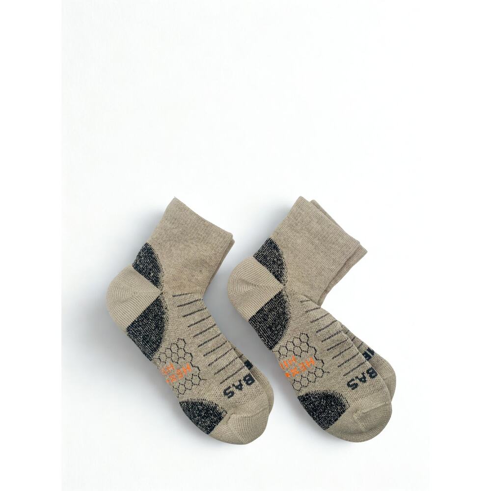 Bombas Tan and Black Low-Cut Performance Socks with Orange Accent.